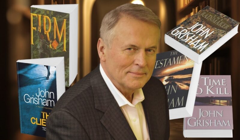 John Grisham with several of his bestselling legal thriller novels including The Firm, The Client, and The Rainmaker